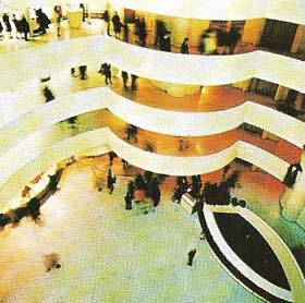The Solomon R. Guggenheim Museum, New York by Frank Lloyd Wright, is designed as a continuous spiral ramp surrounding an open well.