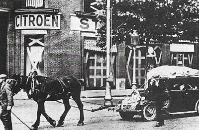 This Frenchman's horsedrawn vehicle laden with goods was one way of overcoming the petrol shortage; bicycle taxis were also common.